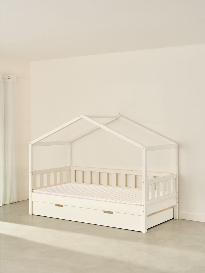 Lit cabane enfant blanc Paris Cabania avec tiroir de rangement, sans barrière, pour chambre bébé.