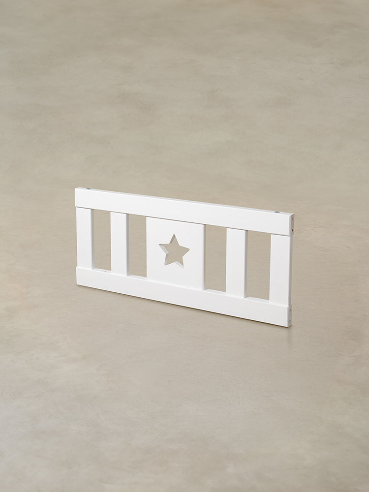 White wooden baby gate with star, ideal for door or staircase.