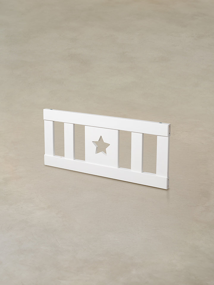 White wooden baby gate with star, ideal for door or staircase.