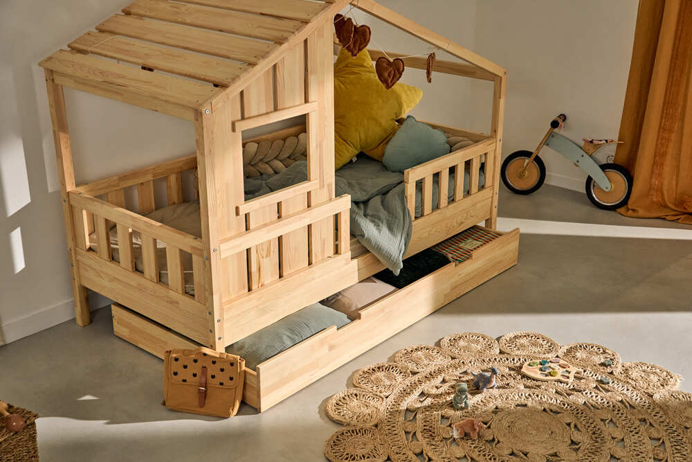 A cabania 901x90 bed in solid pine. Without canopy. Design inspired by forest cabins, in a natural color.