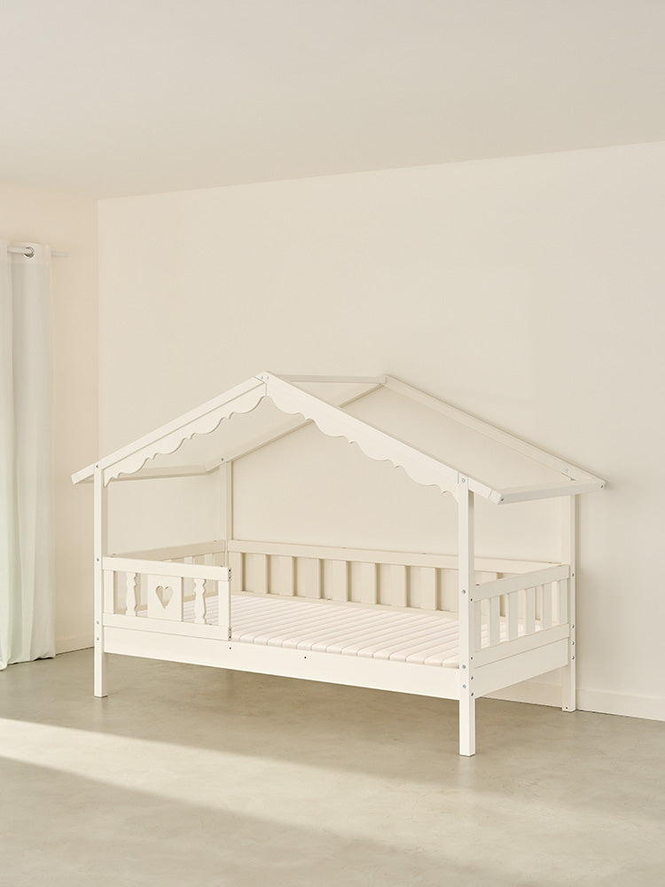 CHAMONIX white wooden children's cabin bed with heart-shaped barrier for a cosy, secure Montessori bedroom.