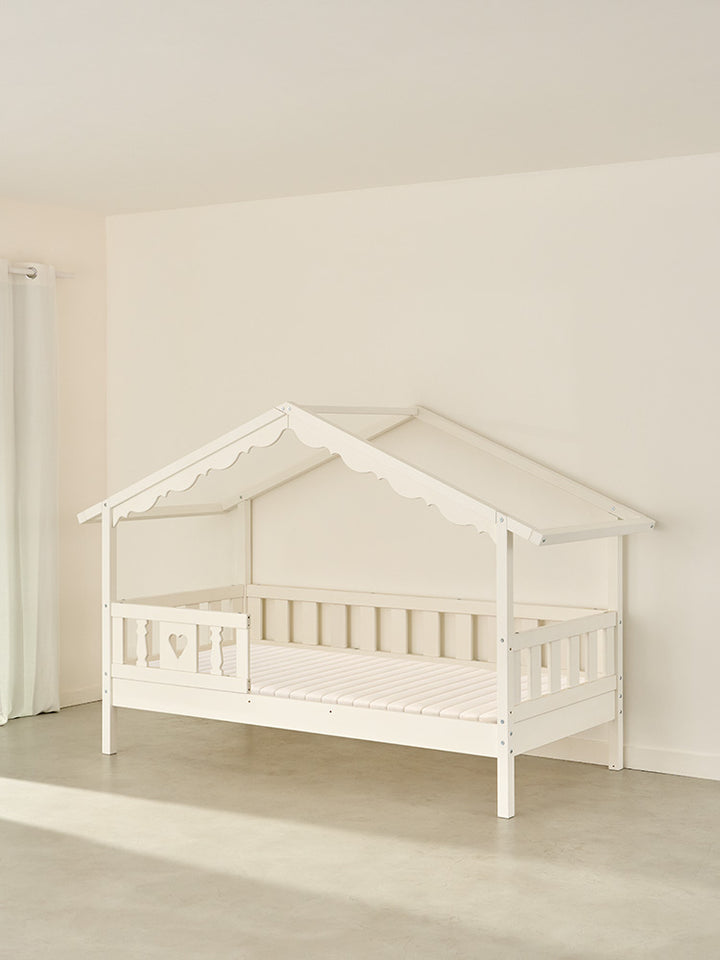 CHAMONIX white wooden children's cabin bed with heart-shaped barrier for a cosy, secure Montessori bedroom.
