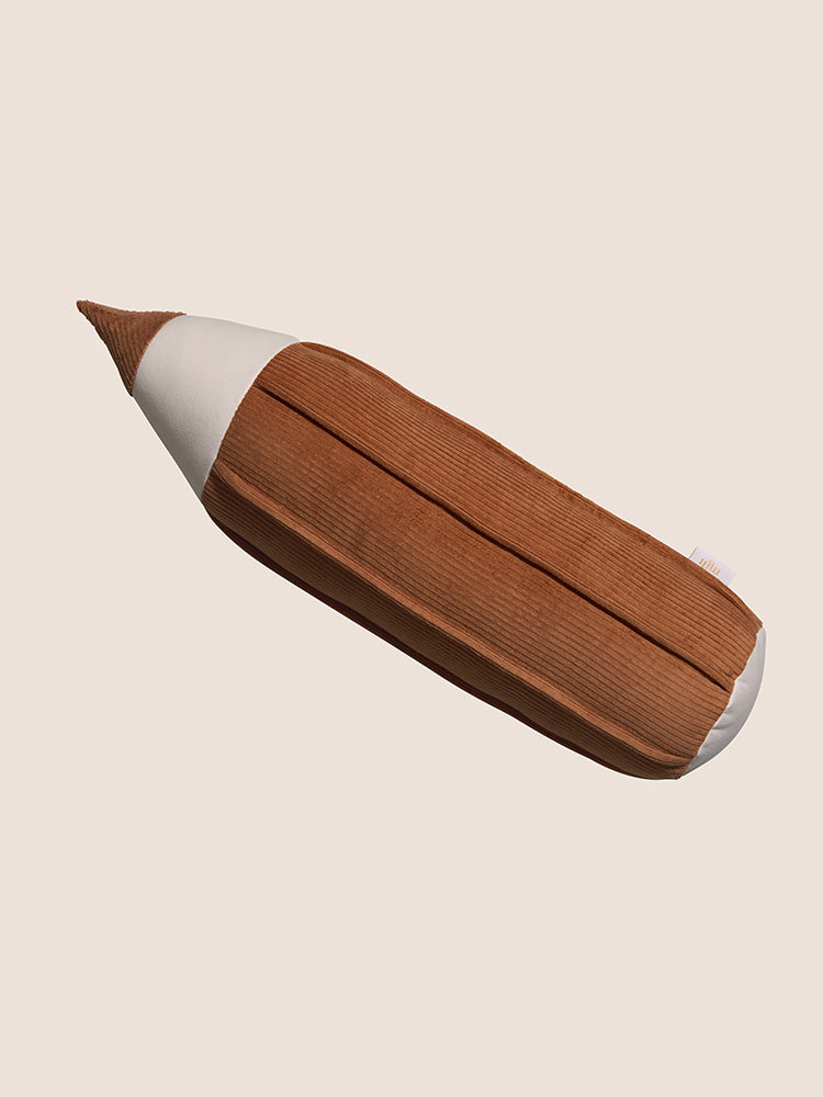 Beautiful decorative cushion in the shape of a cinnamon brown colored pencil for a child's bedroom.