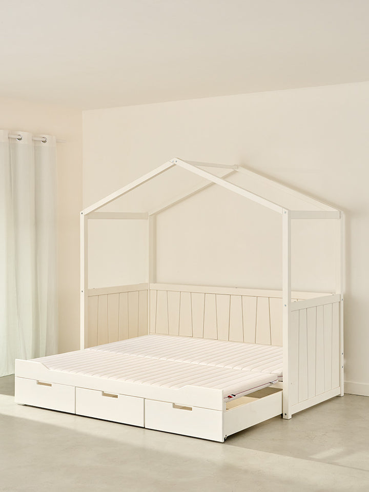 CALVI white trundle cabin bed with fold-out drawer, Montessori style.