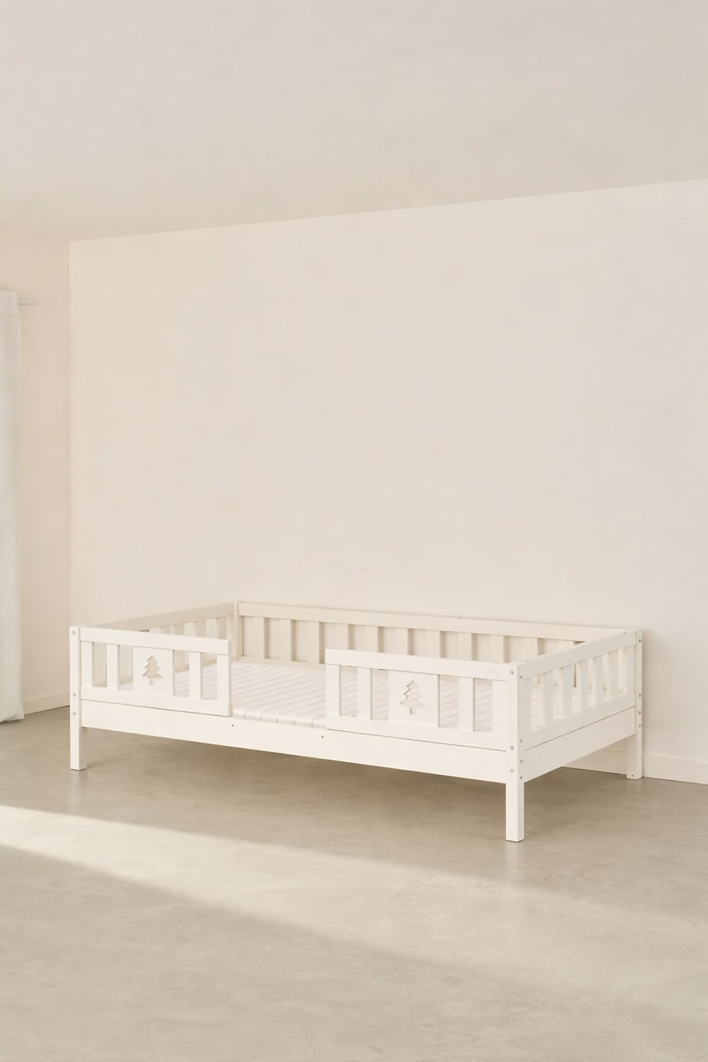 Barcelona white convertible children's bed with two safety rails made from solid natural pine.