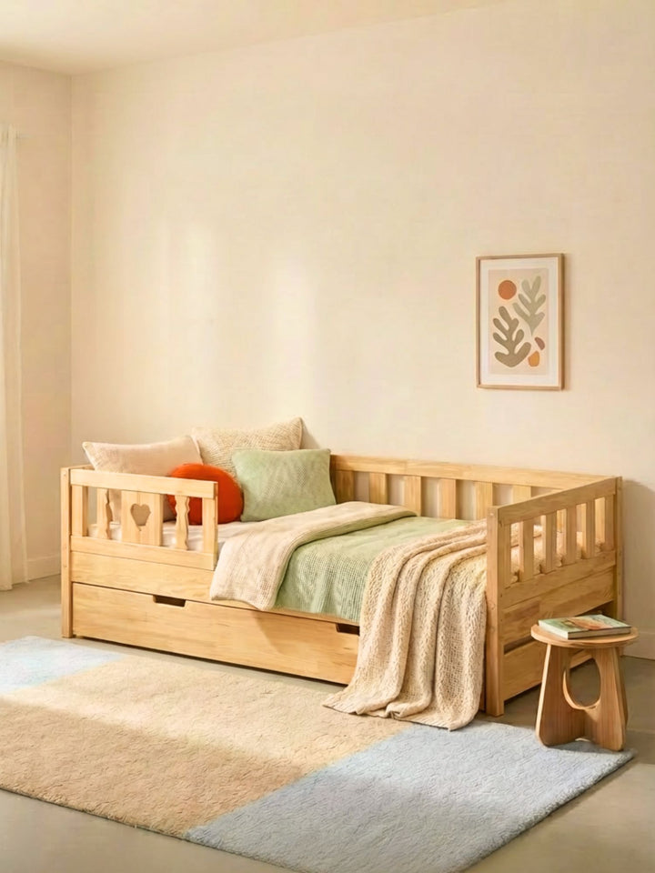 High configuration of the Montessori convertible bed in solid pine with closed extra bed drawer and safety rail