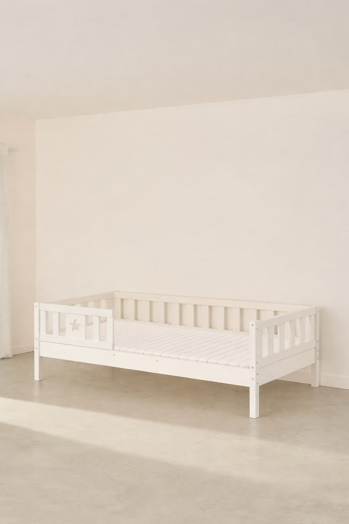 Barcelona white convertible baby bed with star-patterned safety rail, Scandinavian design.