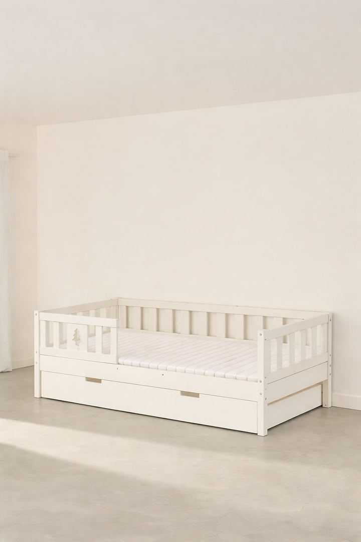 Barcelona white convertible bed with pine barrier, built-in storage drawer for children's bedrooms.
