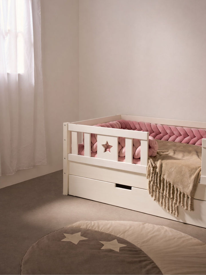 White Barcelona bed raised to 21 cm with large sliding storage drawer and star-shaped guardrail.